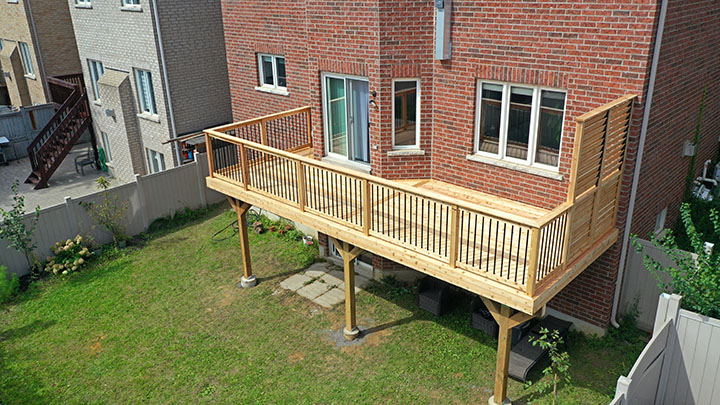tall wooden deck with private screen